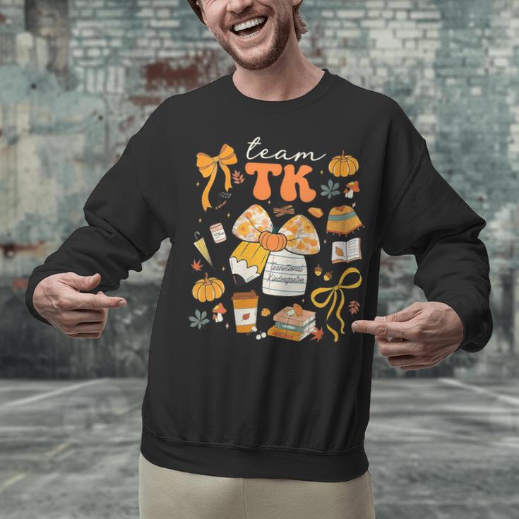 Team TK Crew Preppy Coquette Bow Pumpkin Fall TK Teacher Unisex Sweatshirt, gift for family, gift for coworker Team TK Crew Preppy Coquette Bow Pumpkin Fall TK Teacher Unisex Sweatshirt, gift for family, gift for coworker