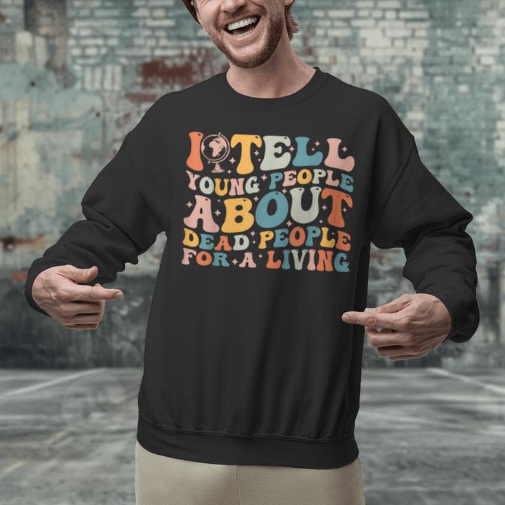 I Tell Young People About Dead People Groovy History Teacher Unisex Sweatshirt, History Teacher Sweatshirts, Groovy Teacher Sweatshirts, gift for family, gift for coworker