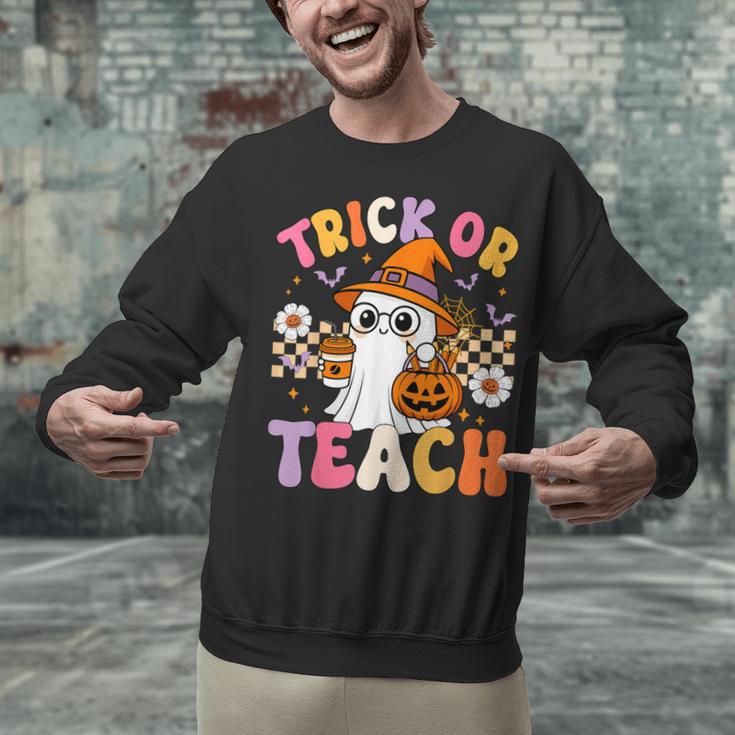 Trick Or Teach Cute Ghost Coffee Pumpkins Halloween Teacher Unisex Sweatshirt, gift for family, gift for coworker Trick Or Teach Cute Ghost Coffee Pumpkins Halloween Teacher Unisex Sweatshirt, gift for family, gift for coworker