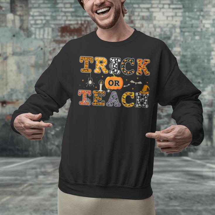 Trick Or Teach Funny School Teacher Halloween Costume Unisex Sweatshirt, gift for family, gift for coworker Trick Or Teach Funny School Teacher Halloween Costume Unisex Sweatshirt, gift for family, gift for coworker