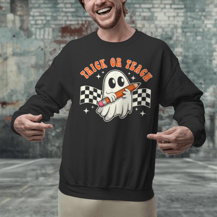 Trick Or Teach Groovy Retro Ghost Halloween Teacher Kids Unisex Sweatshirt, Groovy Teacher Sweatshirts, gift for family, gift for coworker