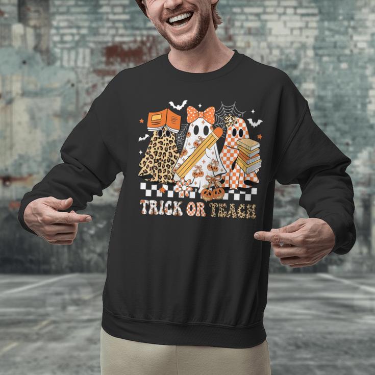 Trick Or Teach Groovy Teacher Halloween Floral Ghost Unisex Sweatshirt, Groovy Teacher Sweatshirts, gift for family, gift for coworker