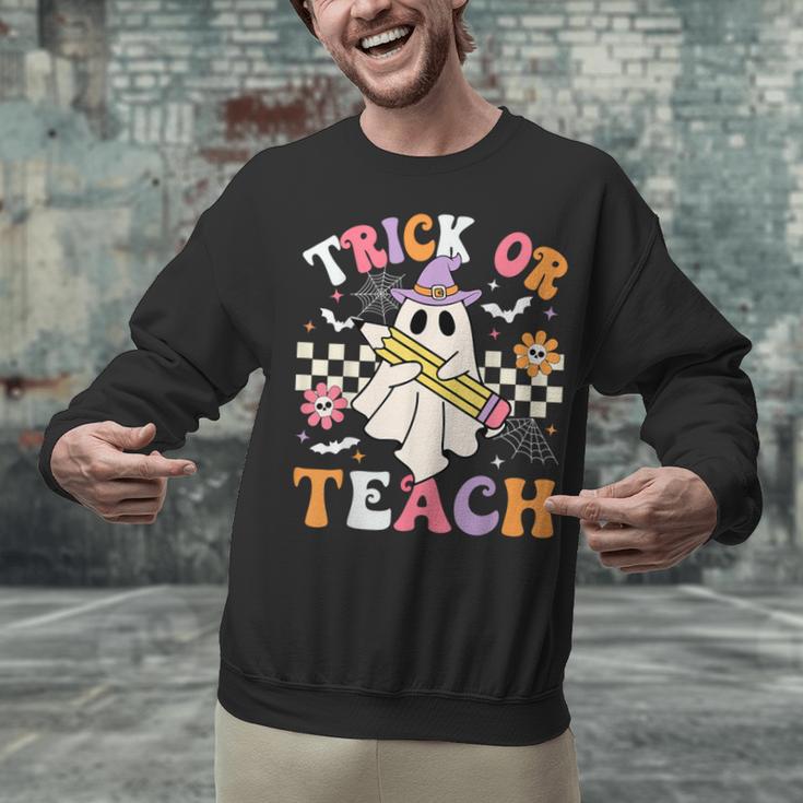 Trick Or Teach Groovy Teacher Halloween Retro Teacher Ghost Unisex Sweatshirt, Groovy Teacher Sweatshirts, gift for family, gift for coworker