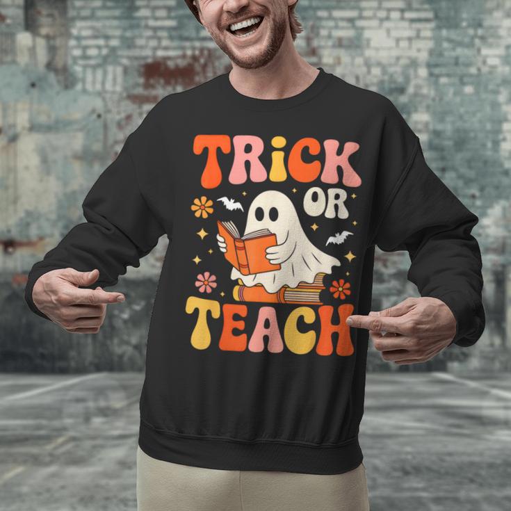 Trick Or Teach Halloween Shirt For Teacher Kids Floral Ghost Unisex Sweatshirt, gift for family, gift for coworker Trick Or Teach Halloween Shirt For Teacher Kids Floral Ghost Unisex Sweatshirt, gift for family, gift for coworker