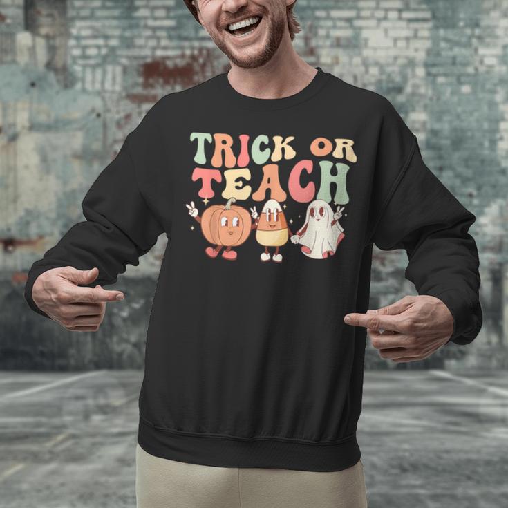 Trick Or Teach Pumpkin Candy Corn Ghost Halloween Teacher Unisex Sweatshirt, gift for family, gift for coworker