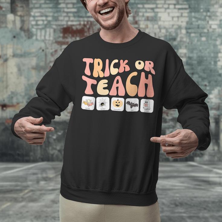 Trick Or Teach With Symbols Special Education Teacher Spooky Unisex Sweatshirt, gift for family, gift for coworker Trick Or Teach With Symbols Special Education Teacher Spooky Unisex Sweatshirt, gift for family, gift for coworker