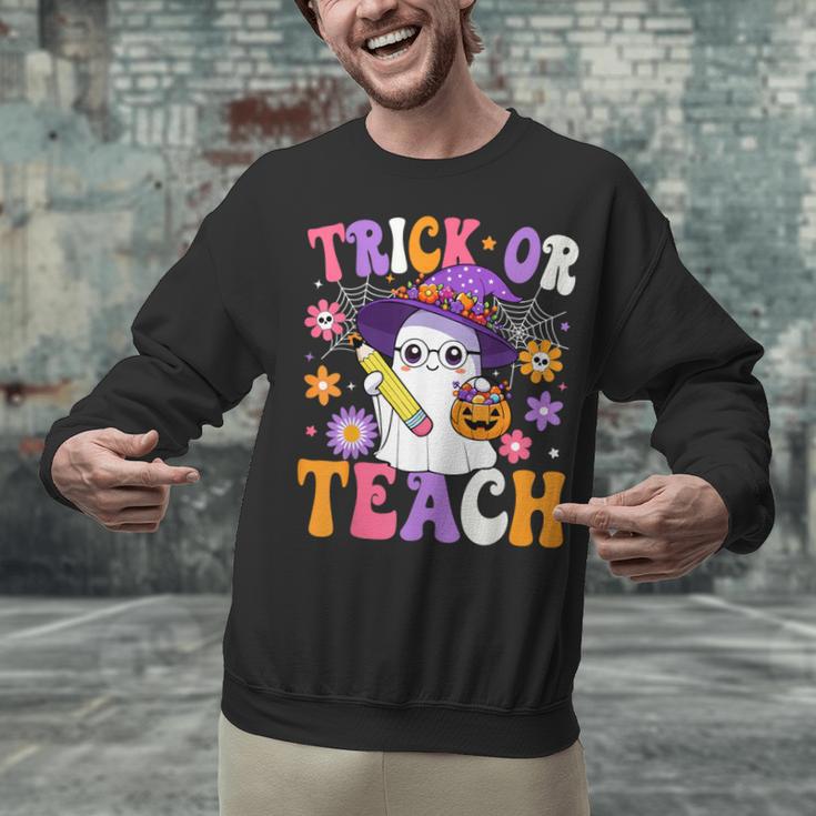 Trick Or Teach Teacher Ghost Teaching Fun Halloween Teacher Unisex Sweatshirt, gift for family, gift for coworker Trick Or Teach Teacher Ghost Teaching Fun Halloween Teacher Unisex Sweatshirt, gift for family, gift for coworker