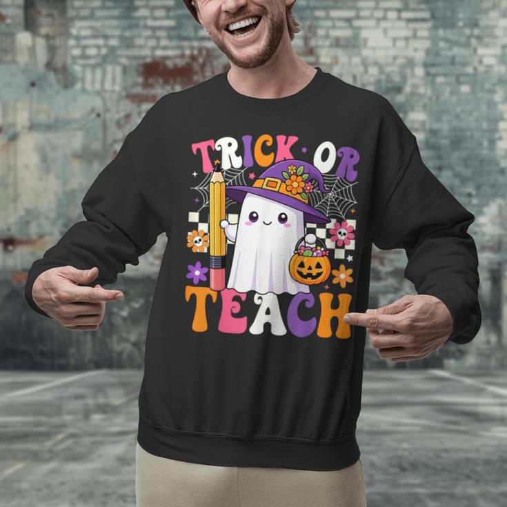 Trick Or Teach Teacher Pencil Ghost Halloween Teacher Unisex Sweatshirt, gift for family, gift for coworker Trick Or Teach Teacher Pencil Ghost Halloween Teacher Unisex Sweatshirt, gift for family, gift for coworker