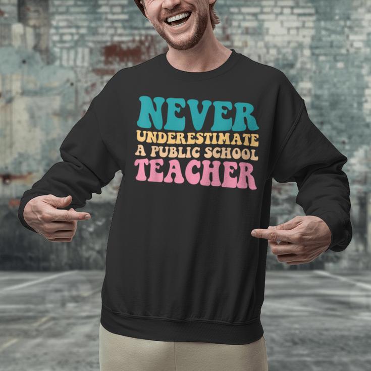 Never Underestimate A Public School Teacher Groovy Women Unisex Sweatshirt, Groovy Teacher Sweatshirts, gift for family, gift for coworker Never Underestimate A Public School Teacher Groovy Women Unisex Sweatshirt, Groovy Teacher Sweatshirts, gift for family, gift for coworker
