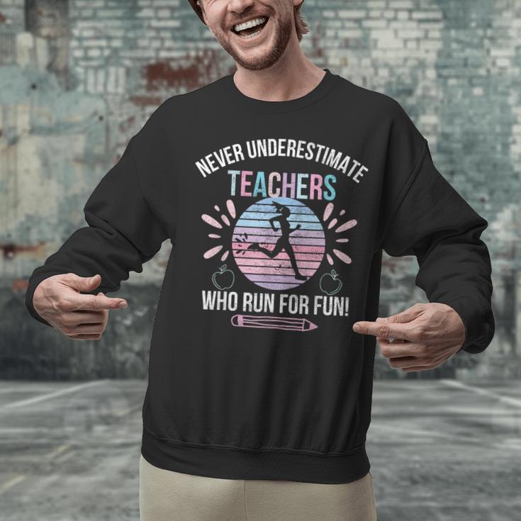 Never Underestimate Teachers Who Runs For Fun Running Teache Unisex Sweatshirt, gift for family, gift for coworker Never Underestimate Teachers Who Runs For Fun Running Teache Unisex Sweatshirt, gift for family, gift for coworker