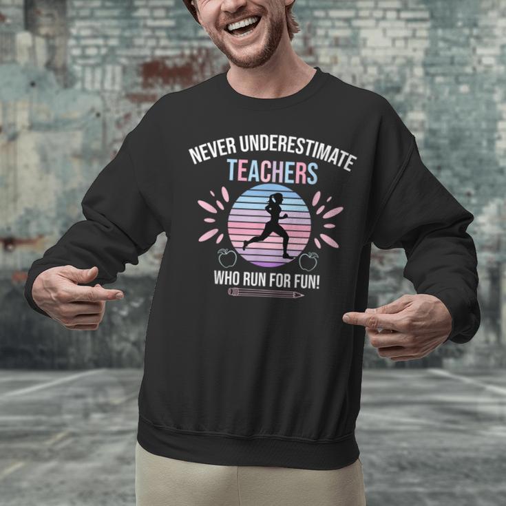 Never Underestimate Teachers Who Runs For Fun Unisex Sweatshirt, gift for family, gift for coworker Never Underestimate Teachers Who Runs For Fun Unisex Sweatshirt, gift for family, gift for coworker