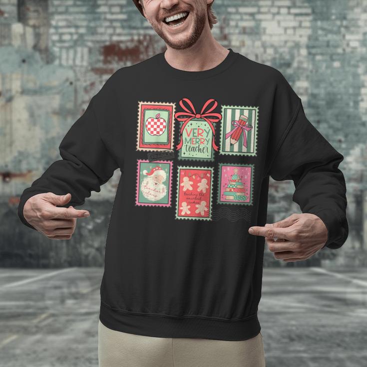 Vintage Preppy Very Merry Teacher Santa Stamps Christmas Unisex Sweatshirt, gift for family, gift for coworker Vintage Preppy Very Merry Teacher Santa Stamps Christmas Unisex Sweatshirt, gift for family, gift for coworker