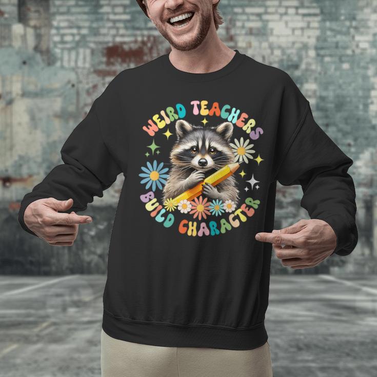 Weird Teachers Build Character Raccoon Colourful Floral Unisex Sweatshirt, gift for family, gift for coworker