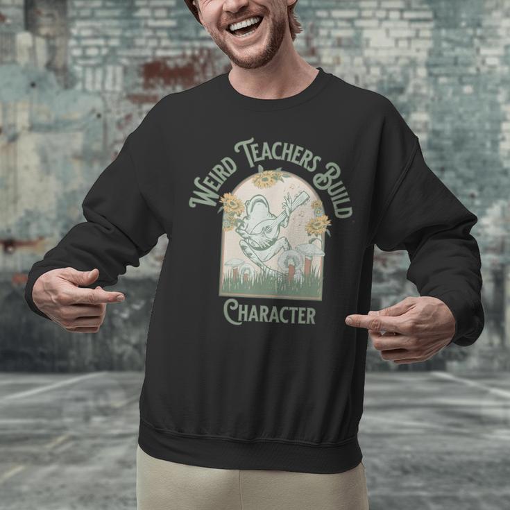 Weird Teachers Build Character- Teacher's Day Unisex Sweatshirt, gift for family, gift for coworker Weird Teachers Build Character- Teacher's Day Unisex Sweatshirt, gift for family, gift for coworker