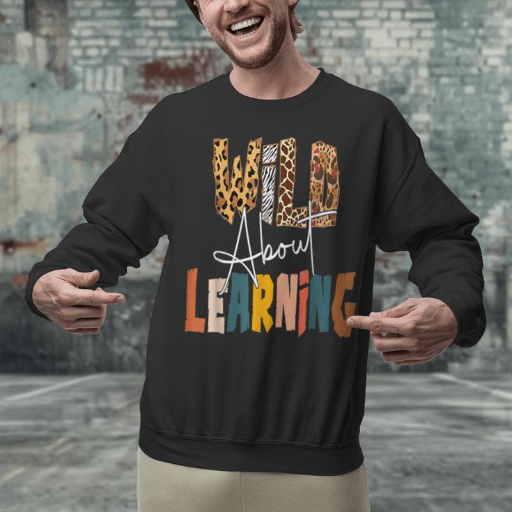 Wild About Learning Teacher Back To School Teaching Unisex Sweatshirt, gift for family, gift for coworker Wild About Learning Teacher Back To School Teaching Unisex Sweatshirt, gift for family, gift for coworker