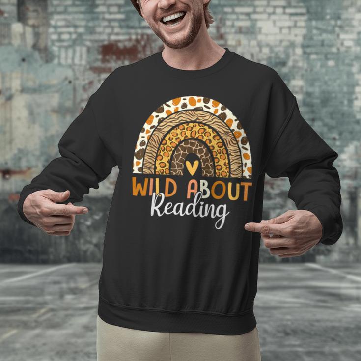 Wild About Reading Teacher Back To School Leopard Rainbow Unisex Sweatshirt, gift for family, gift for coworker