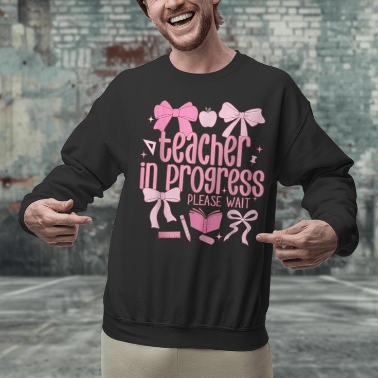 Women Teacher In Progress Coquette Pink Bow Future Teacher Unisex Sweatshirt, Future Teacher Sweatshirts, gift for family, gift for coworker