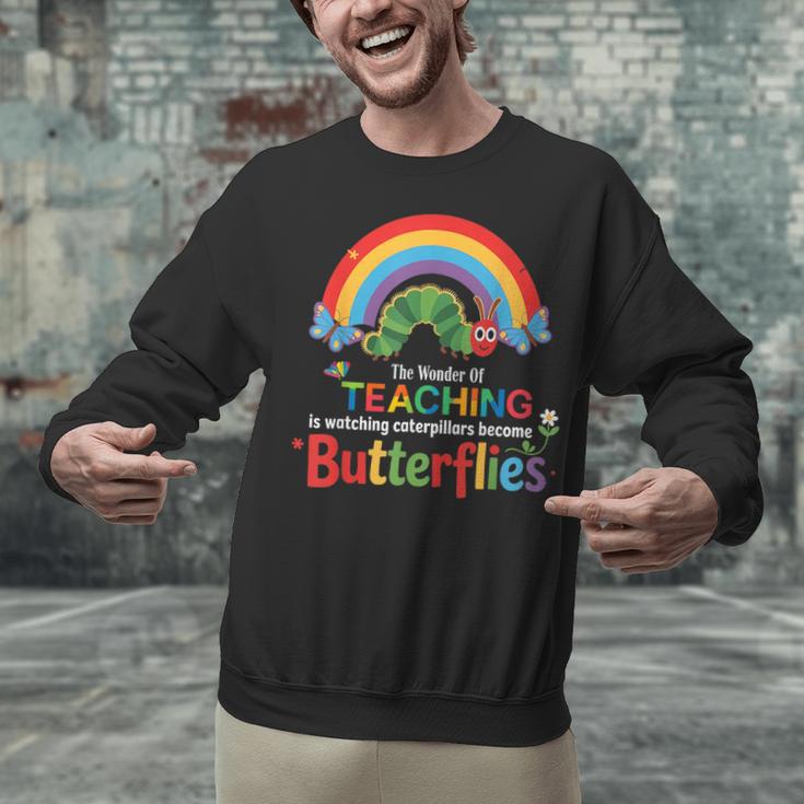 The Wonder Of Teaching Is Watching Caterpillars Teacher Unisex Sweatshirt, gift for family, gift for coworker The Wonder Of Teaching Is Watching Caterpillars Teacher Unisex Sweatshirt, gift for family, gift for coworker