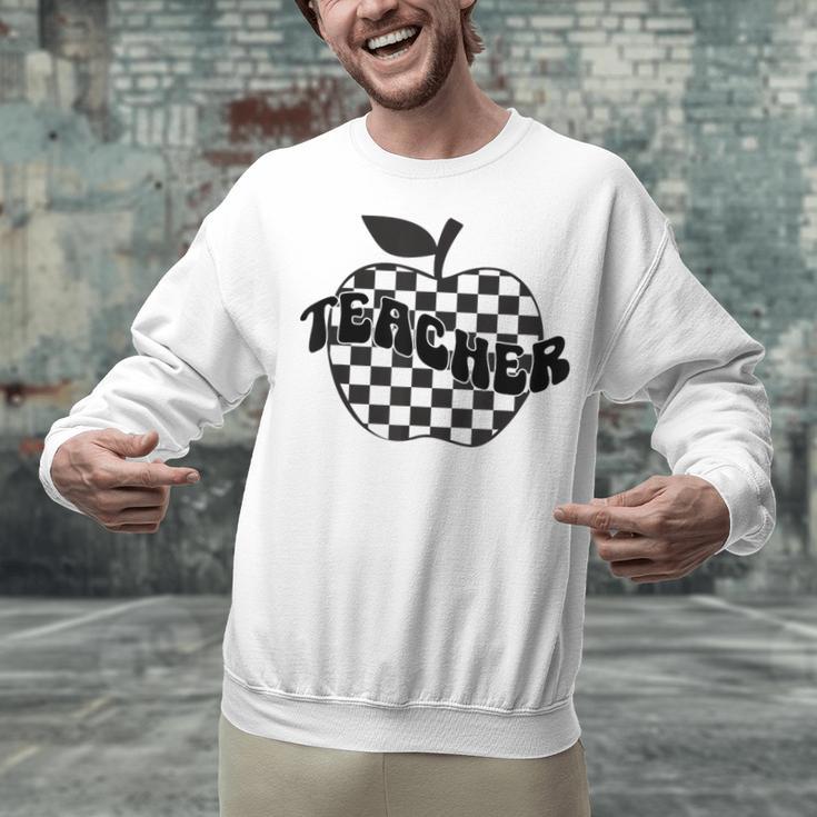 Back To School Checkered Apple Teacher Checkerboard Teacher For Men Women Girls Kids Unisex Sweatshirt, gift for family, gift for coworker Back To School Checkered Apple Teacher Checkerboard Teacher For Men Women Girls Kids Unisex Sweatshirt, gift for family, gift for coworker