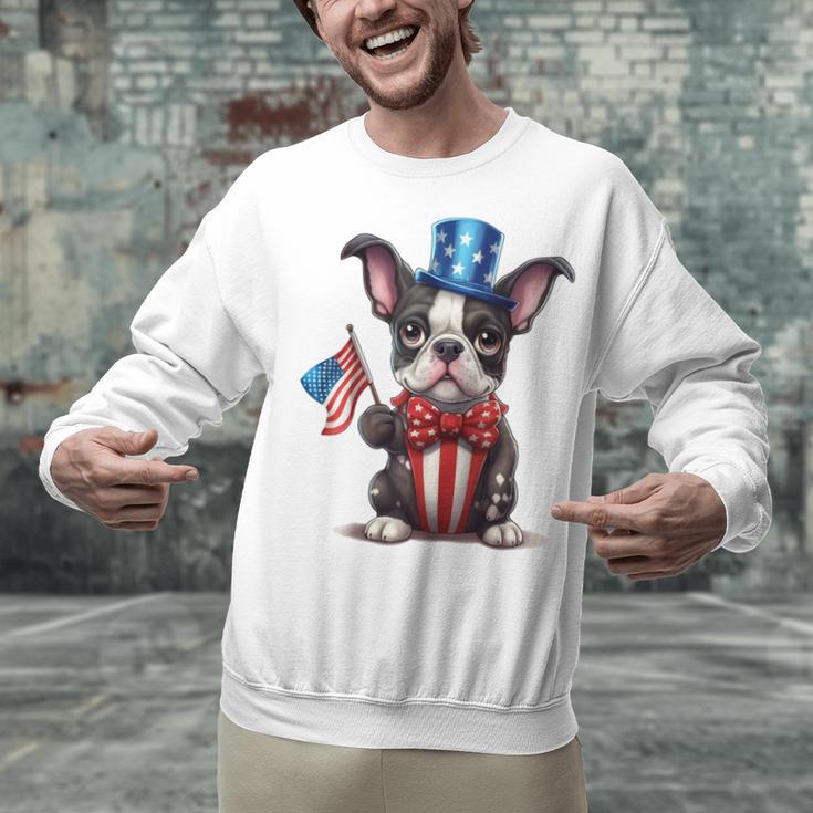 Boston Terrier Puppy Dog Holds His American Flag 4th Of July Unisex Sweatshirt, American Boston Terrier Sweatshirts, Boston Terrier 4th Of July Sweatshirts, gift for family, gift for coworker