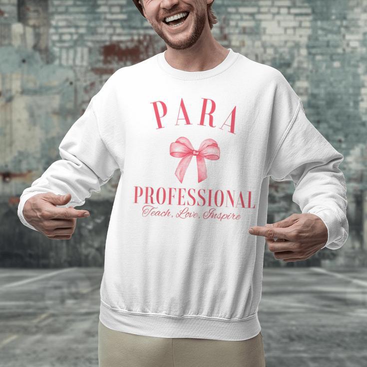 Coquette Bow Paraprofessional School Para Squad Teacher Aide Unisex Sweatshirt, gift for family, gift for coworker Coquette Bow Paraprofessional School Para Squad Teacher Aide Unisex Sweatshirt, gift for family, gift for coworker