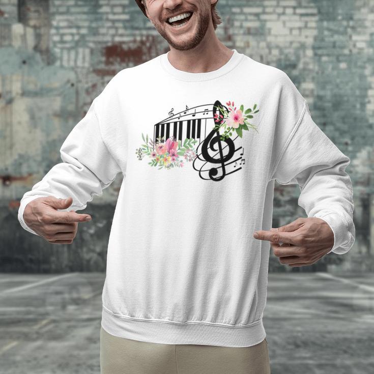 Cut Music Teacher Shirt With a Piano Keys Notes And Flowers Unisex Sweatshirt, gift for family, gift for coworker Cut Music Teacher Shirt With a Piano Keys Notes And Flowers Unisex Sweatshirt, gift for family, gift for coworker