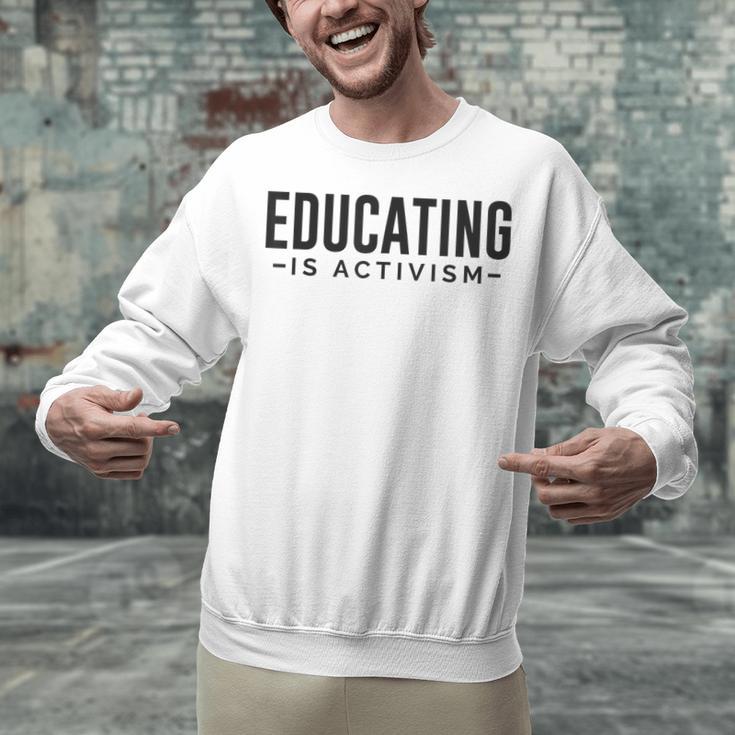 Educating Is Activism Feminist Social Justice Teacher For Men Women Unisex Sweatshirt, gift for family, gift for coworker