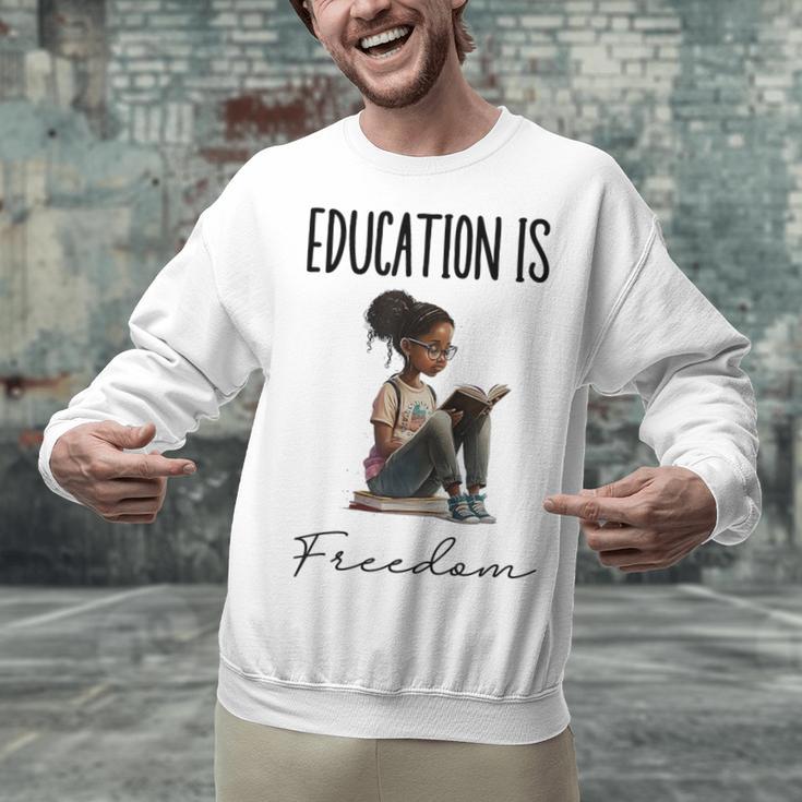 Education Is Freedom Teacher Books Black History Month Unisex Sweatshirt, History Teacher Sweatshirts, gift for family, gift for coworker Education Is Freedom Teacher Books Black History Month Unisex Sweatshirt, History Teacher Sweatshirts, gift for family, gift for coworker