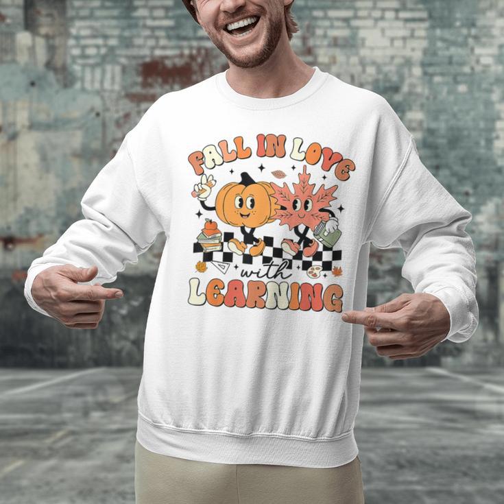 Fall In Love With Learning Teacher Retro Thanksgiving Unisex Sweatshirt, gift for family, gift for coworker Fall In Love With Learning Teacher Retro Thanksgiving Unisex Sweatshirt, gift for family, gift for coworker