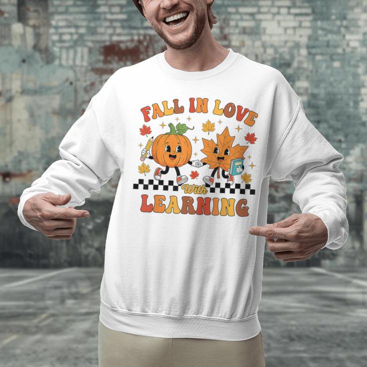 Fall In Love With Learning Teacher Student Autumn Pumpkin Unisex Sweatshirt, gift for family, gift for coworker Fall In Love With Learning Teacher Student Autumn Pumpkin Unisex Sweatshirt, gift for family, gift for coworker