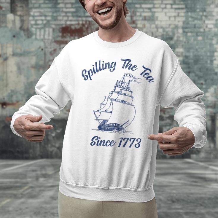 Fun 4th Of July Spilling The Tea Since 1773 History Teacher Unisex Sweatshirt, History Teacher Sweatshirts, gift for family, gift for coworker Fun 4th Of July Spilling The Tea Since 1773 History Teacher Unisex Sweatshirt, History Teacher Sweatshirts, gift for family, gift for coworker