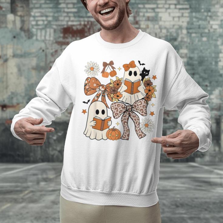 Ghost Reading Books Halloween Bow Spooky Teacher Student Unisex Sweatshirt, gift for family, gift for coworker Ghost Reading Books Halloween Bow Spooky Teacher Student Unisex Sweatshirt, gift for family, gift for coworker