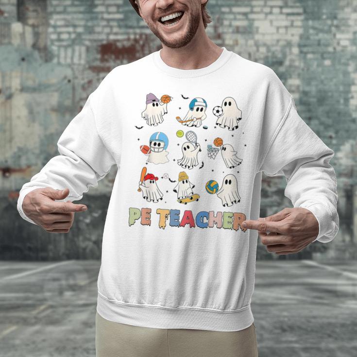 Halloween PE Teacher Spooky Physical Education Teacher Unisex Sweatshirt, Pe Teacher Sweatshirts, gift for family, gift for coworker Halloween PE Teacher Spooky Physical Education Teacher Unisex Sweatshirt, Pe Teacher Sweatshirts, gift for family, gift for coworker
