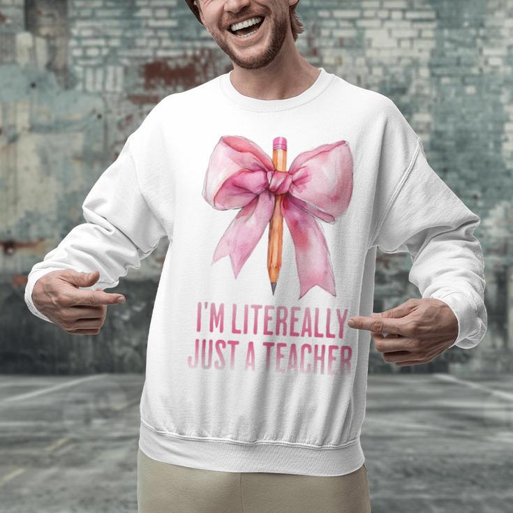 I'm Literally Just a Teacher Pencil Coquette Bow School Unisex Sweatshirt, gift for family, gift for coworker I'm Literally Just a Teacher Pencil Coquette Bow School Unisex Sweatshirt, gift for family, gift for coworker