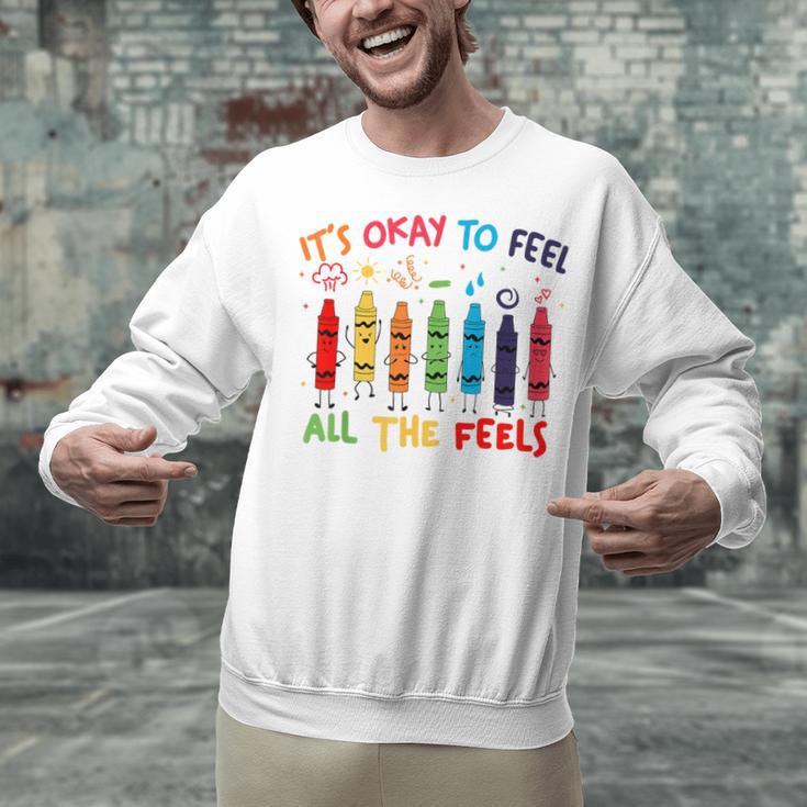 Its Okay To Feel All The Feels Mood Color Crayons Teacher Unisex Sweatshirt, gift for family, gift for coworker Its Okay To Feel All The Feels Mood Color Crayons Teacher Unisex Sweatshirt, gift for family, gift for coworker