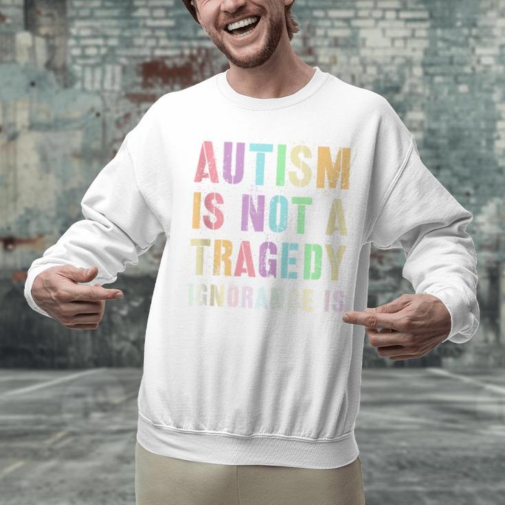 Kids AUTISM IS NOT A TRAGEDY IGNORANCE IS Proud Teacher Crew Unisex Sweatshirt, gift for family, gift for coworker