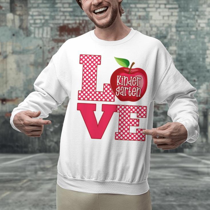Love Kindergarten Cute Apple School Teacher Unisex Sweatshirt, gift for family, gift for coworker Love Kindergarten Cute Apple School Teacher Unisex Sweatshirt, gift for family, gift for coworker