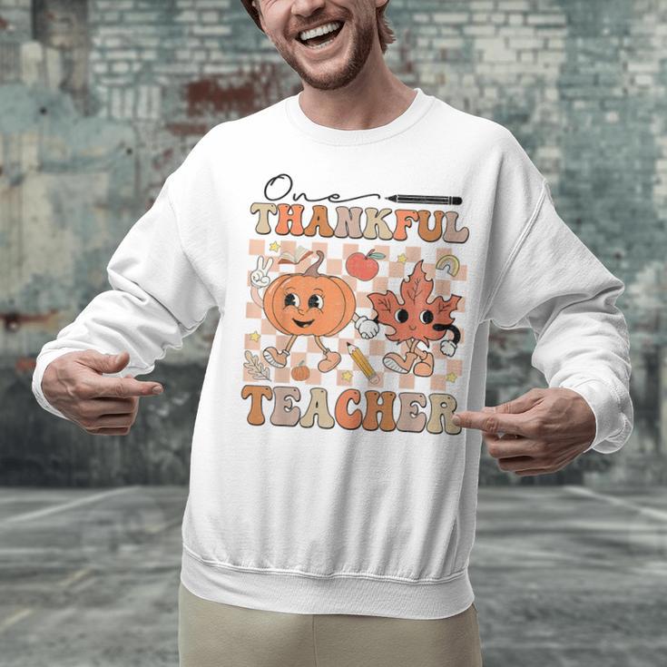One Thankful Teacher Thanksgiving Groovy Fall Autumn Teacher Unisex Sweatshirt, Groovy Teacher Sweatshirts, gift for family, gift for coworker One Thankful Teacher Thanksgiving Groovy Fall Autumn Teacher Unisex Sweatshirt, Groovy Teacher Sweatshirts, gift for family, gift for coworker