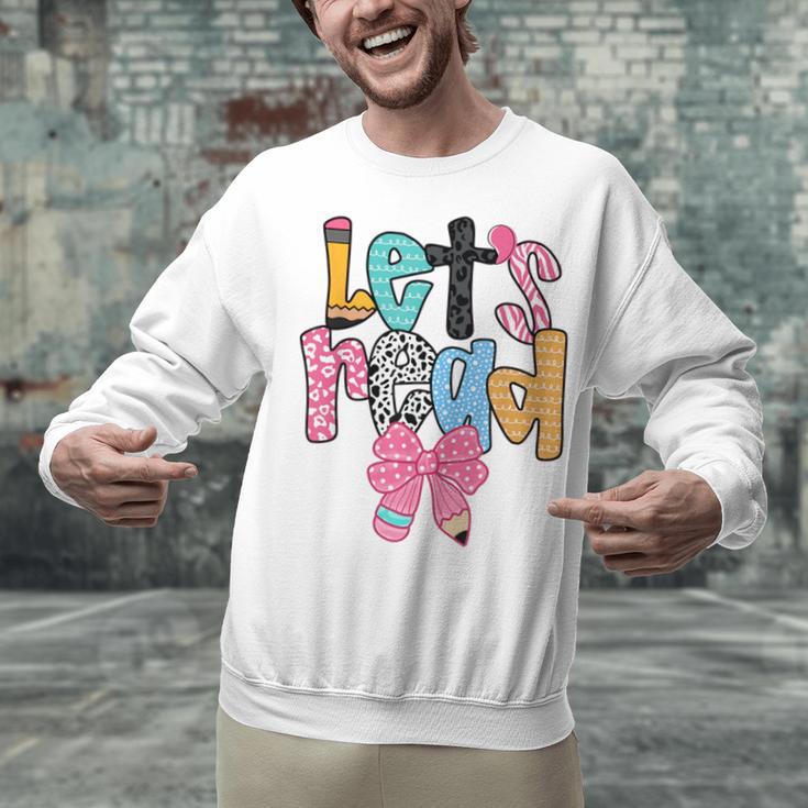 Lets Read Reading Teacher Back To School Literacy Pencil Bow Unisex Sweatshirt, gift for family, gift for coworker Lets Read Reading Teacher Back To School Literacy Pencil Bow Unisex Sweatshirt, gift for family, gift for coworker