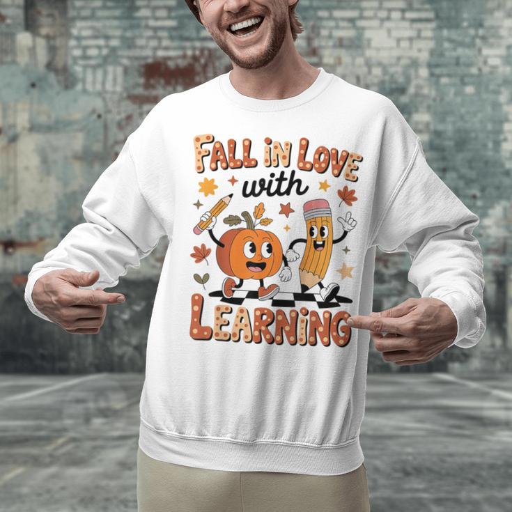 Retro Fall In Love With Learning Autumn Pumpkin Teacher Kids Unisex Sweatshirt, gift for family, gift for coworker Retro Fall In Love With Learning Autumn Pumpkin Teacher Kids Unisex Sweatshirt, gift for family, gift for coworker
