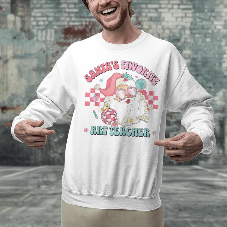 Retro Pink Christmas Santa's Favorite Art Teacher Artist Unisex Sweatshirt, gift for family, gift for coworker