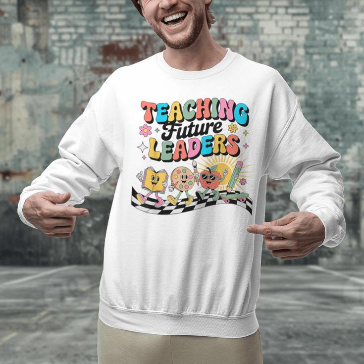Retro Teaching Future Leaders Groovy Teacher Back To School Unisex Sweatshirt, Future Teacher Sweatshirts, Groovy Teacher Sweatshirts, gift for family, gift for coworker Retro Teaching Future Leaders Groovy Teacher Back To School Unisex Sweatshirt, Future Teacher Sweatshirts, Groovy Teacher Sweatshirts, gift for family, gift for coworker