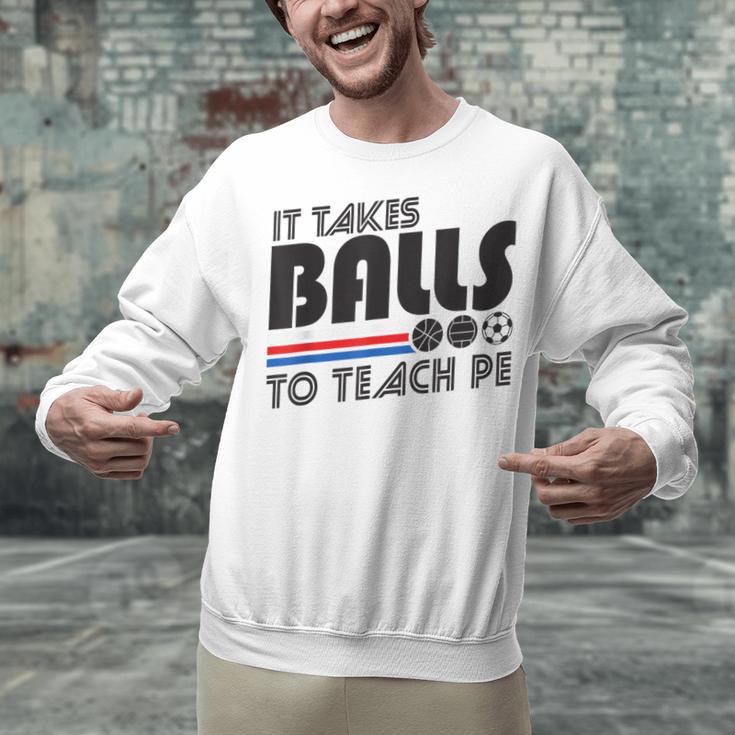 It Takes Balls To Teach PE Gym Teacher Unisex Sweatshirt, Pe Teacher Sweatshirts, gift for family, gift for coworker It Takes Balls To Teach PE Gym Teacher Unisex Sweatshirt, Pe Teacher Sweatshirts, gift for family, gift for coworker