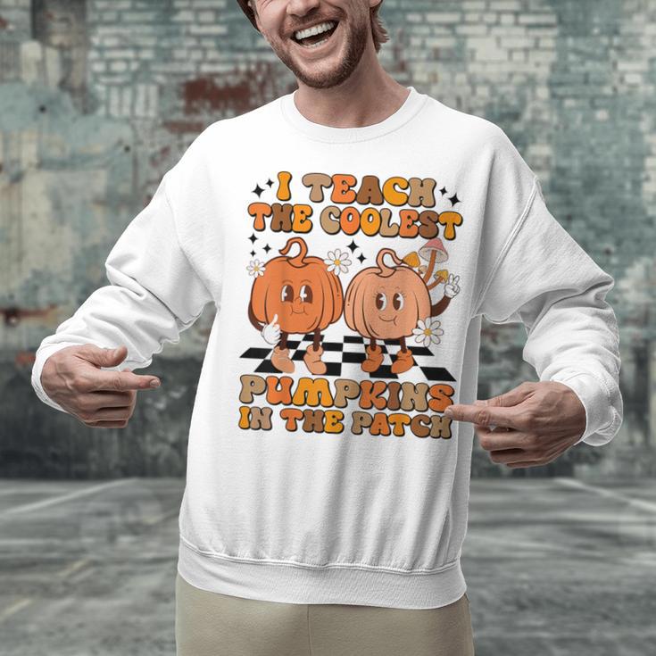 I Teach The Coolest Pumpkins In The Patch Teacher Halloween Unisex Sweatshirt, gift for family, gift for coworker I Teach The Coolest Pumpkins In The Patch Teacher Halloween Unisex Sweatshirt, gift for family, gift for coworker