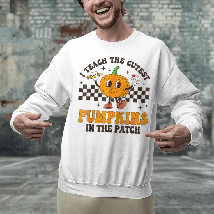 I Teach The Cutest Pumpkins In The Patch Groovy Teacher Fall Unisex Sweatshirt, Groovy Teacher Sweatshirts, gift for family, gift for coworker