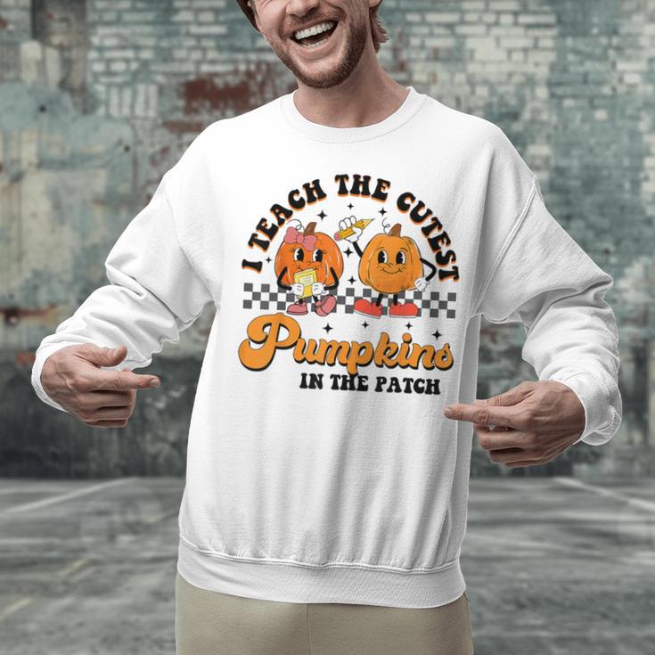 I Teach The Cutest Pumpkins In The Patch Halloween Teacher For Men Women Kids Unisex Sweatshirt, gift for family, gift for coworker I Teach The Cutest Pumpkins In The Patch Halloween Teacher For Men Women Kids Unisex Sweatshirt, gift for family, gift for coworker