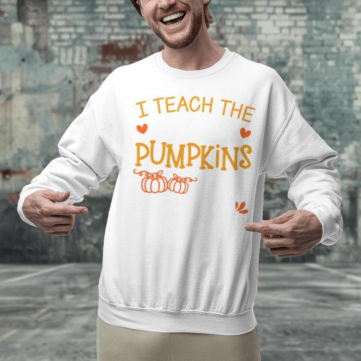 I Teach The Cutest Pumpkins In The Patch Shirt Teacher Unisex Sweatshirt, gift for family, gift for coworker