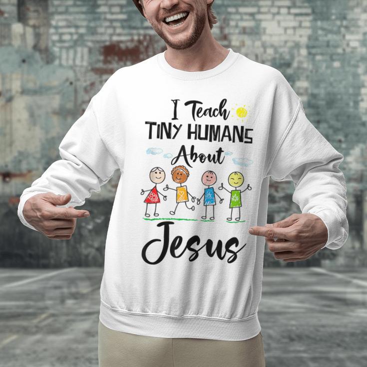 I Teach Tiny Humans About Jesus Sunday School Teacher Unisex Sweatshirt, gift for family, gift for coworker I Teach Tiny Humans About Jesus Sunday School Teacher Unisex Sweatshirt, gift for family, gift for coworker
