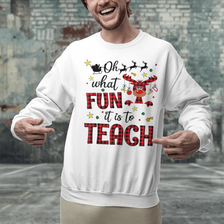 Teachers Oh What Fun It Is To Teach Cute Red Plaid Reindeer Unisex Sweatshirt, gift for family, gift for coworker Teachers Oh What Fun It Is To Teach Cute Red Plaid Reindeer Unisex Sweatshirt, gift for family, gift for coworker