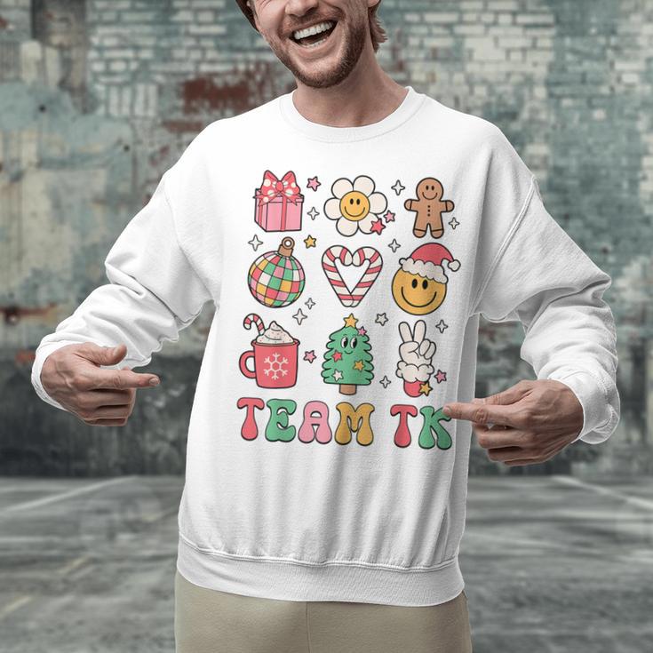 Team TK Teacher Christmas Groovy Smile Face Girl Boy Kid TK Unisex Sweatshirt, Groovy Teacher Sweatshirts, gift for family, gift for coworker Team TK Teacher Christmas Groovy Smile Face Girl Boy Kid TK Unisex Sweatshirt, Groovy Teacher Sweatshirts, gift for family, gift for coworker